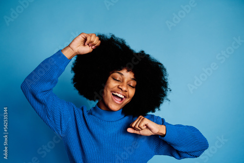 Cheerful black woman celebrating victory