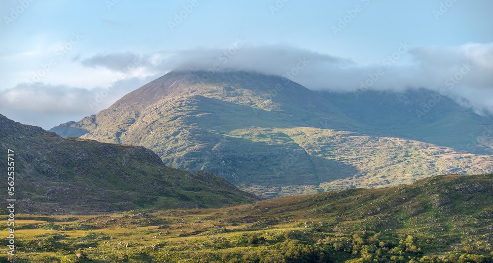 Clouds and green mountains with lakes, amazing nature of Ireland in Killarney National Park, Ring of Kerry, near the town of Killarney, County Kerry