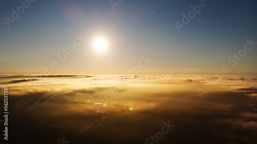 Morning, sunrise. Shooting with a drone above the morning fog.