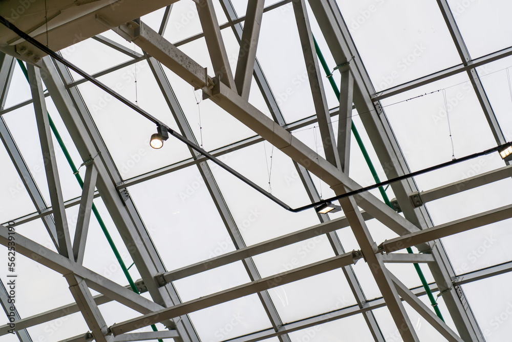 Metal framed glass roof of modern building. Fastening of Glass on the Facade Metal framed glass roof of modern building. Fastening of Glass on the Facade