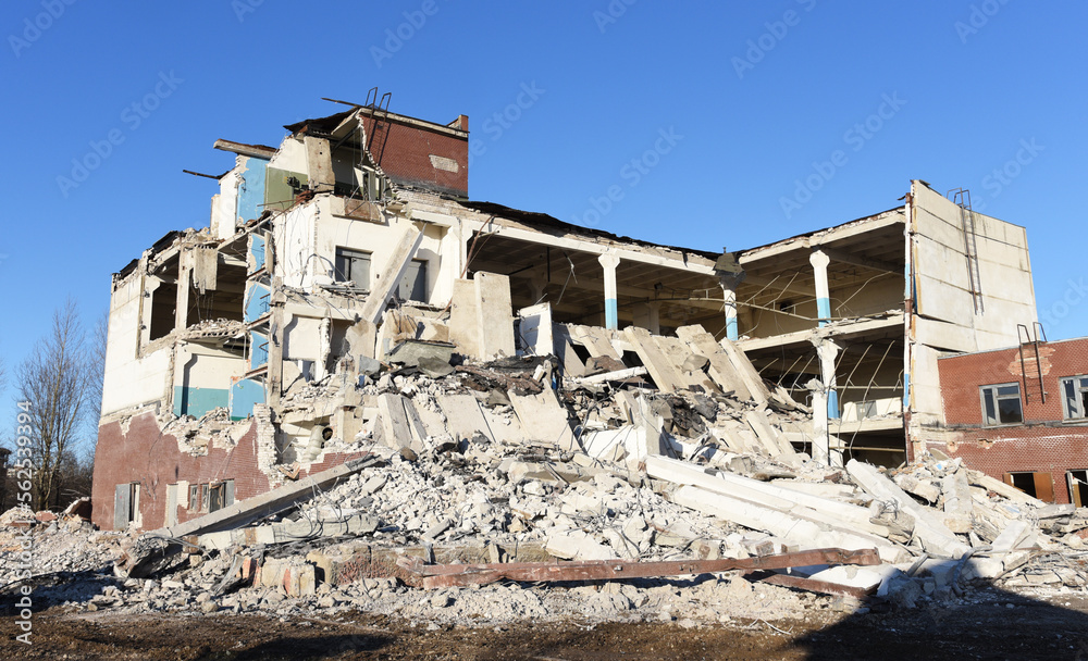 Demolition of a multi-storey building. Dismantling and demolition of buildings and structures. Destroy concrete house.