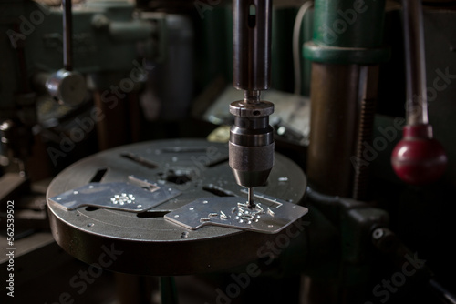 Part machining with drilling machine photo