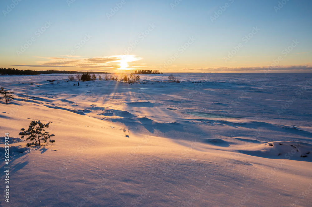 Sunset over the frozen sea. Fäboda, Jakobstad/Pietarsaari.  Finland.
