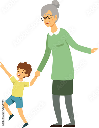 Old woman walking with grandson. Happy boy with grandmother