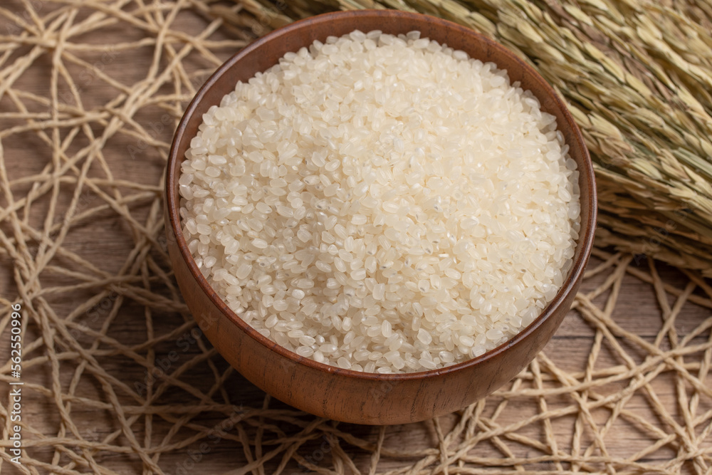 White rice, Masu and ears of rice on a white background White rice, Masu and ears of rice on a white background