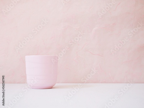Coffee cup ,Pink Tea cup on white table Pink background for lettering writing message for Mother's day ,Valentine's ,Greeting card ,Celebrate ,empty wall Copy space Romantic love festive card