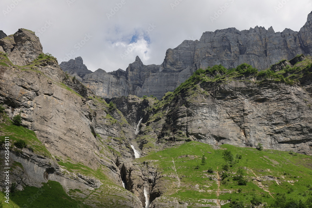 View on waterfalls in the Cirque du Fer-à-Cheval which is a natural circus of France located in the territory of the commune of Sixt-Fer-à-Cheval, in the department of Haute-Savoie