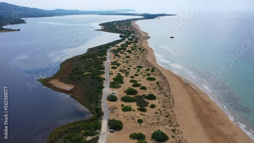 Aerial drone view of Halikounas Beach and Lake Korission, Corfu island, Ionian Sea, Greece. Halikounas Beach, Corfu Island. View of the deserted, sandy, windy beach on the western part of Corfu. photo