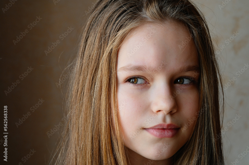 The girl looks into the distance. A romantic image. Portrait of a beautiful woman with long hair looking into the distance. The girl looks into the distance. A romantic image. Portrait of a beautiful woman with long hair looking into the distance.