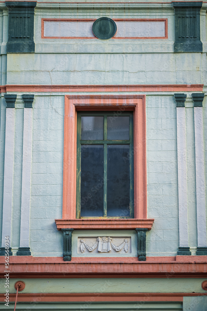 Old Wintergreen and White Building with Pink Facade.