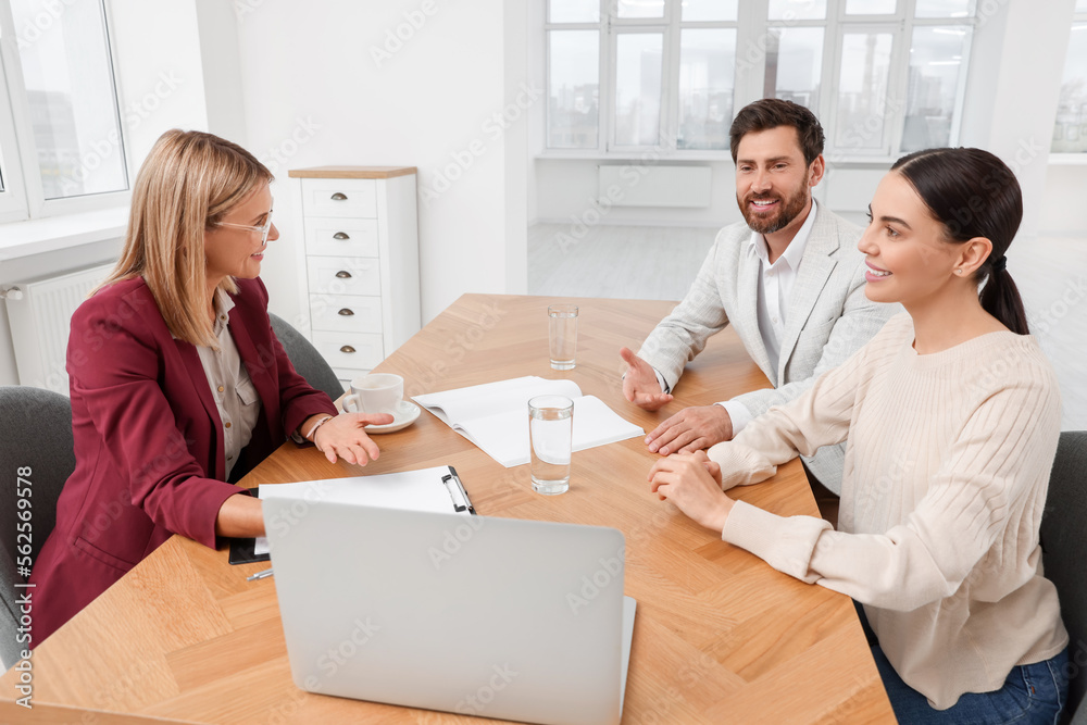 Real estate agent working with couple in new apartment Real estate agent working with couple in new apartment