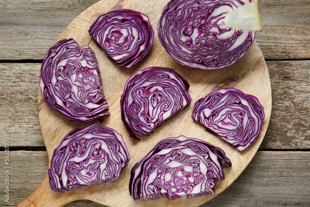 Tray with slices of fresh red cabbage on wooden table, flat lay Tray with slices of fresh red cabbage on wooden table, flat lay