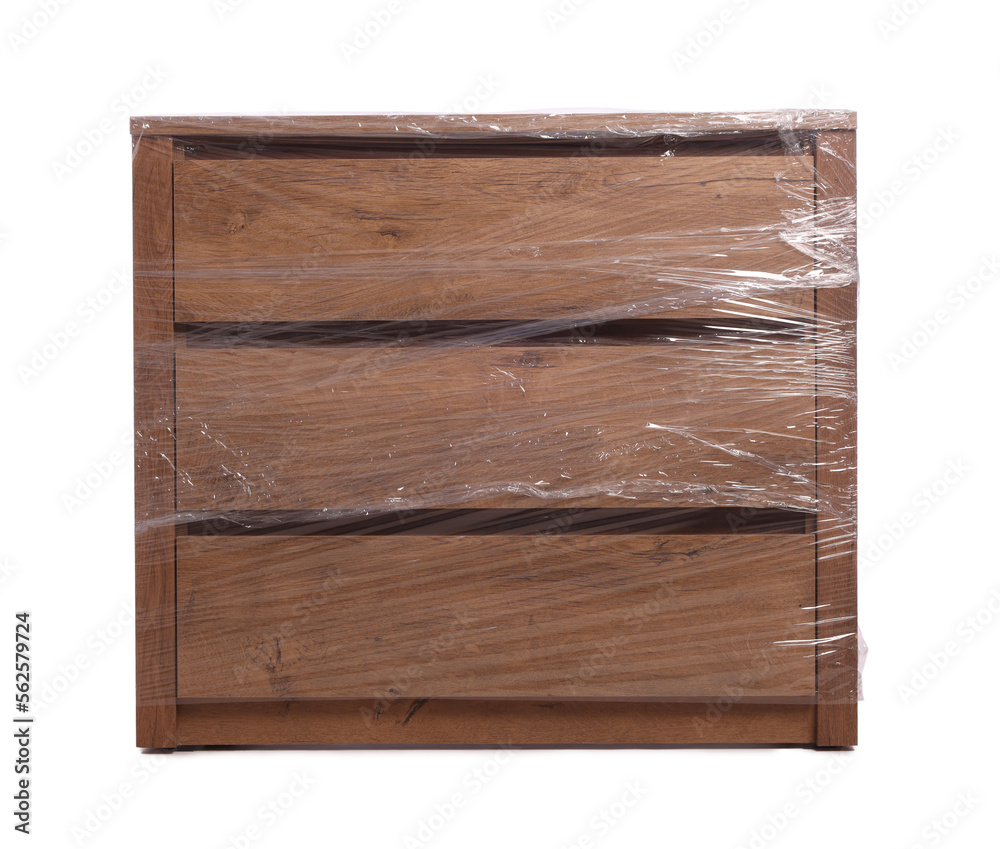 Chest of drawers wrapped in stretch film on white background Chest of drawers wrapped in stretch film on white background