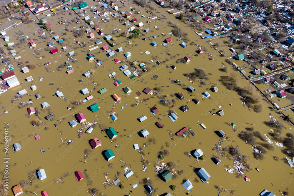 Obraz premium Aerial view of the flooded suburban areas during the spring flood. Houses in the water during the flood