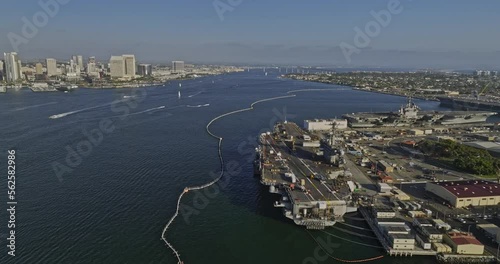 San Diego California Aerial v85 fly around aircraft carrier ship in north island coronado overlooking at downtown cityscape across the bay in daytime - Shot with Mavic 3 Cine - September 2022 photo