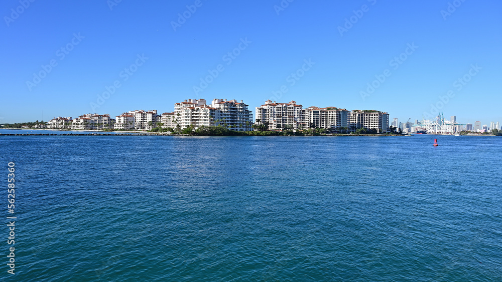 Fisher Island condominiums off South Beach in Miami Beach, Florida on clear cloudless sunny morning.
