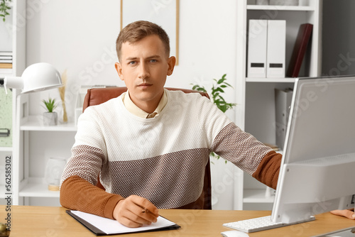 Young businessman sitting a...
