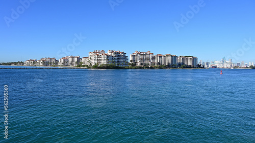 Fisher Island condominiums off South Beach in Miami Beach, Florida on clear cloudless sunny morning.