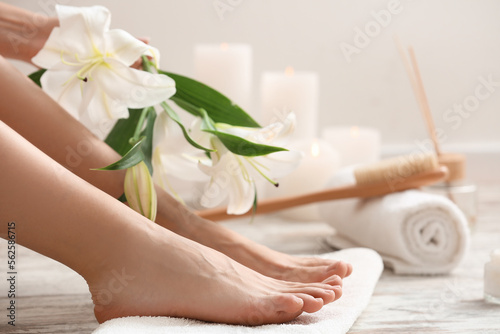 Woman with beautiful pedicure and towel in salon, closeup