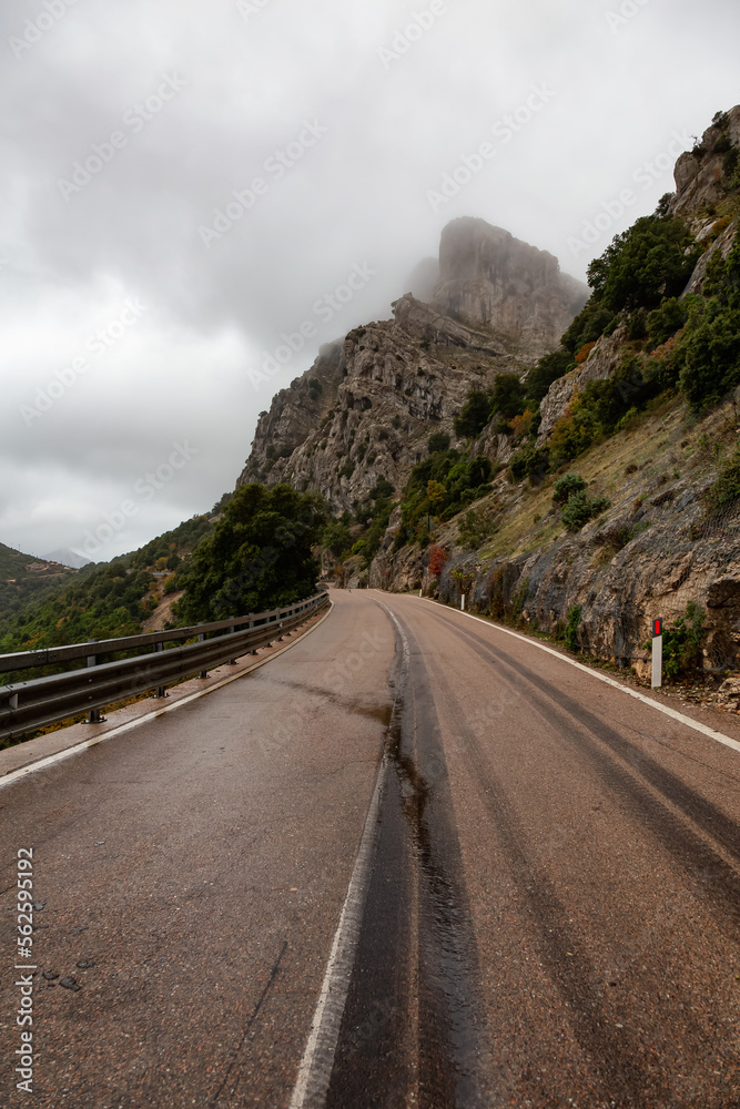 Scenic Highway, Orientale Sarda, in the mountain landscape. Cloudy Rainy Day. Sardinia, Italy.
