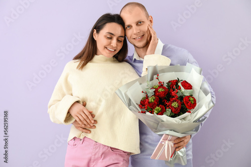 Happy couple embracing with...