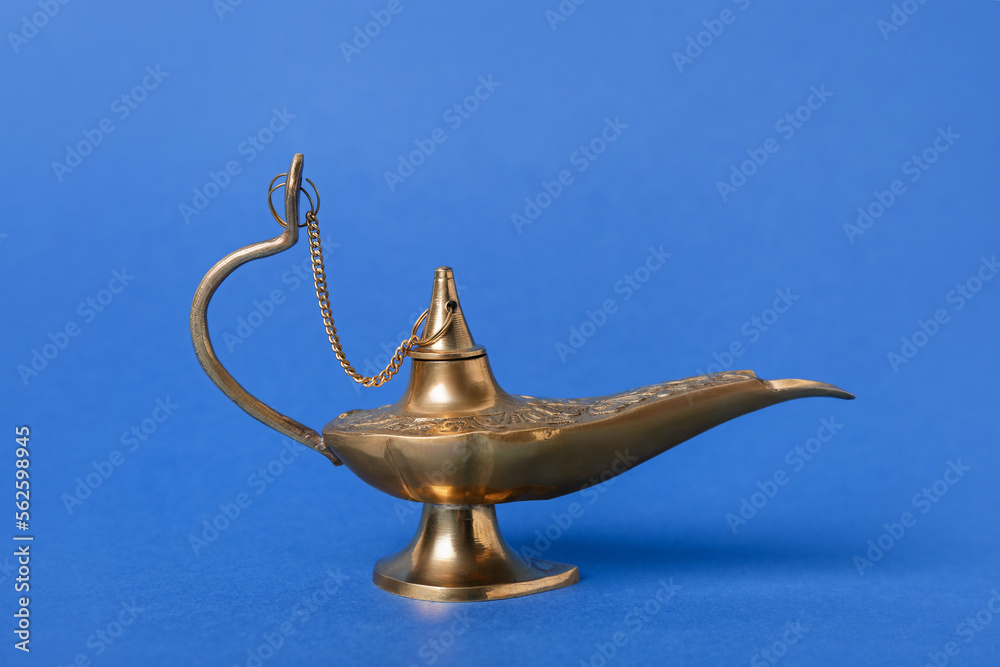 Aladdin lamp of wishes for Ramadan on blue background Aladdin lamp of wishes for Ramadan on blue background