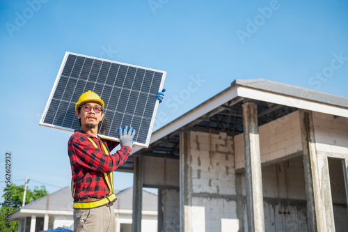 Wallpaper Mural Technicians carrying solar panels ready to be installed on the roof of a housing estate energy-saving and cost-saving concept Own a small business installing solar panels. Torontodigital.ca