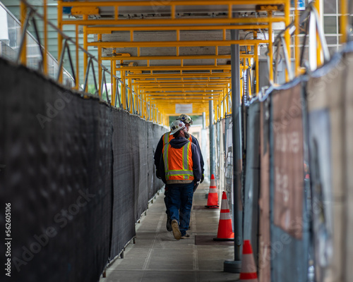 Construction workers walking through jobsite © John