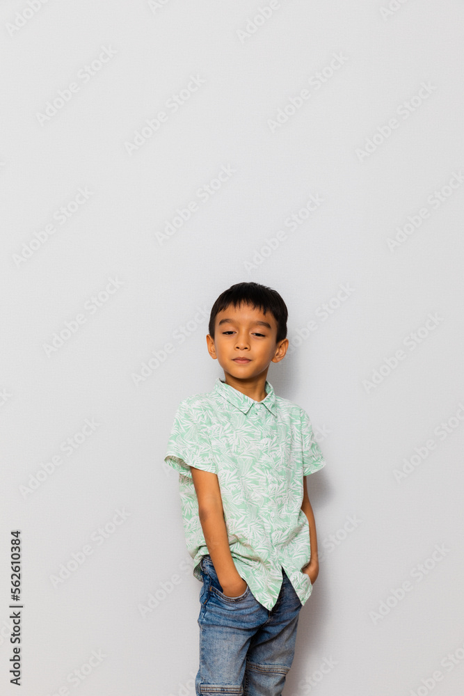 Cute little boy in casual outfit on background Cute little boy in casual outfit on background