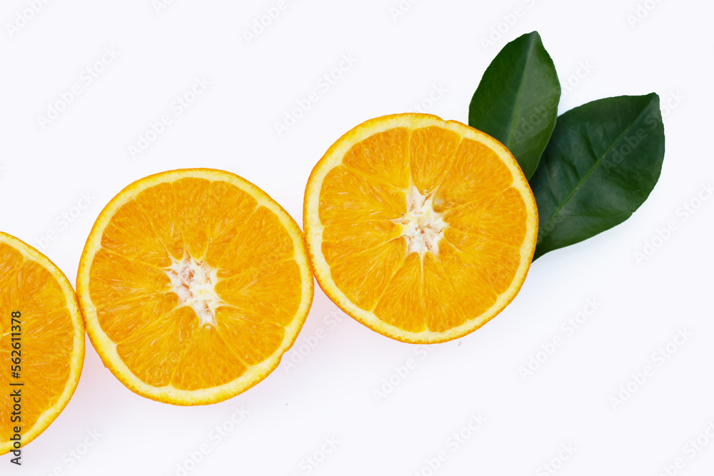 Orange fruit with green leaves on white background.