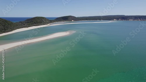 Panorama Of Rainbow Beach Town And Double Island Point On A Sunny Summer Day In Cooloola, Queensland. aerial pan left photo