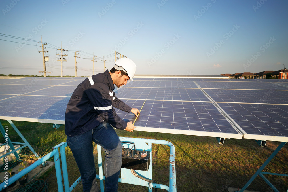 Solar power plant, Electrician working on checking and maintenance, Installing solar panels equipment. 