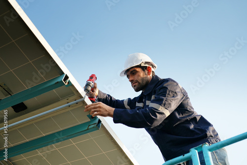 Solar power plant, Electrician working on checking and maintenance, Installing solar panels equipment. 