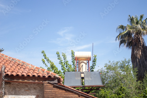 Solar water heaters on the roof. Renewable energy for house.
