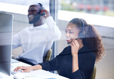 Call center, funny and employees laughing on a computer for consulting, telemarketing and customer support. Comic, contact us and happy customer service agents working in technical support on a pc
