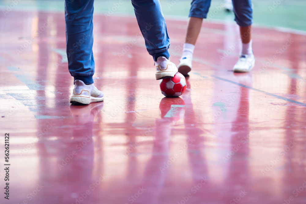 Selective focus to red ball with futsal player. Selective focus to red ball with futsal player.