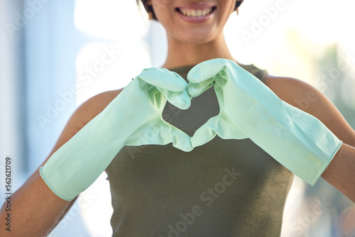Cleaner with heart hand, love cleaning with woman, housekeeping with gloves for safety, disinfection and health. Emoji, clean and housekeeper with domestic service, wellness and happy person