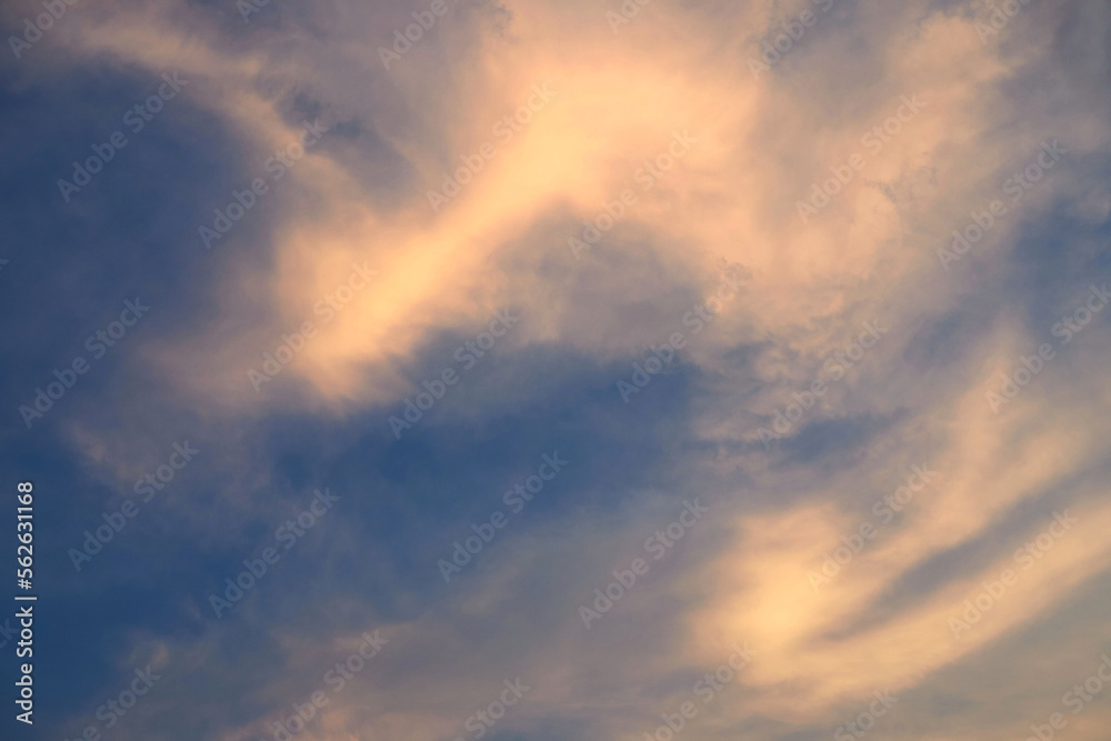 Fluffy clouds with warm light in sunset