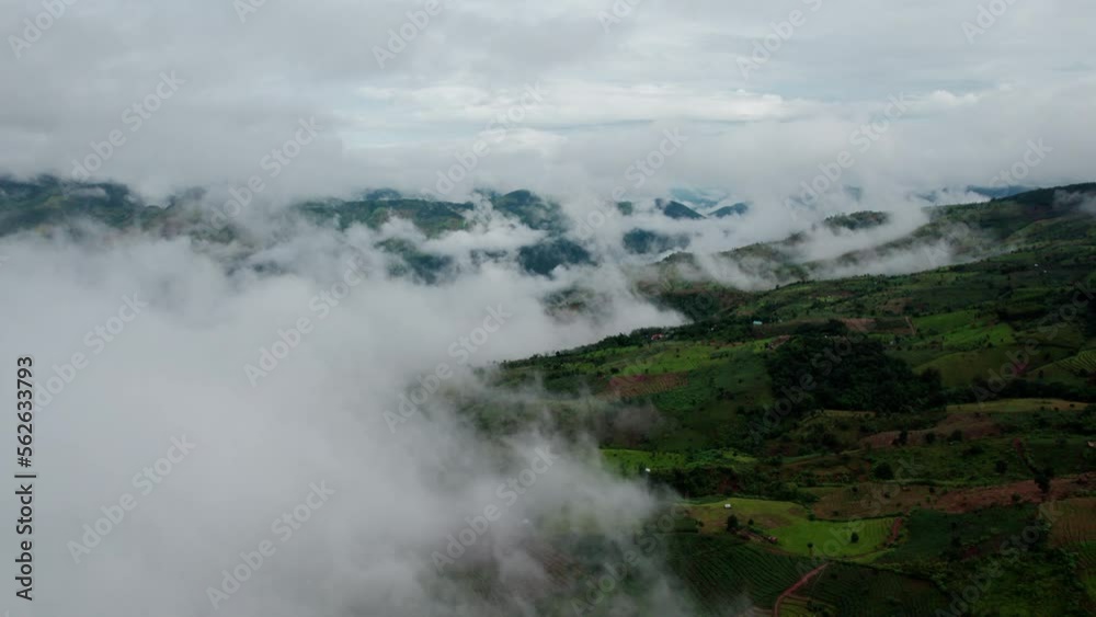 Top view Landscape of Morning Mist with Mountain Layer at north of Thailand. mountain ridge and clouds in rural jungle bush forest