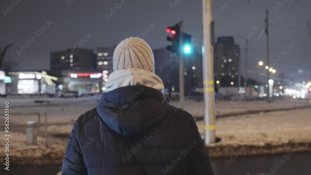 Person crossing street on flashing green light, make it on time concept Person crossing street on flashing green light, make it on time concept