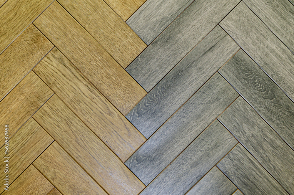 Fototapeta premium Texture of different motley boards laid diagonally. Background, corner parquet. laminate floor