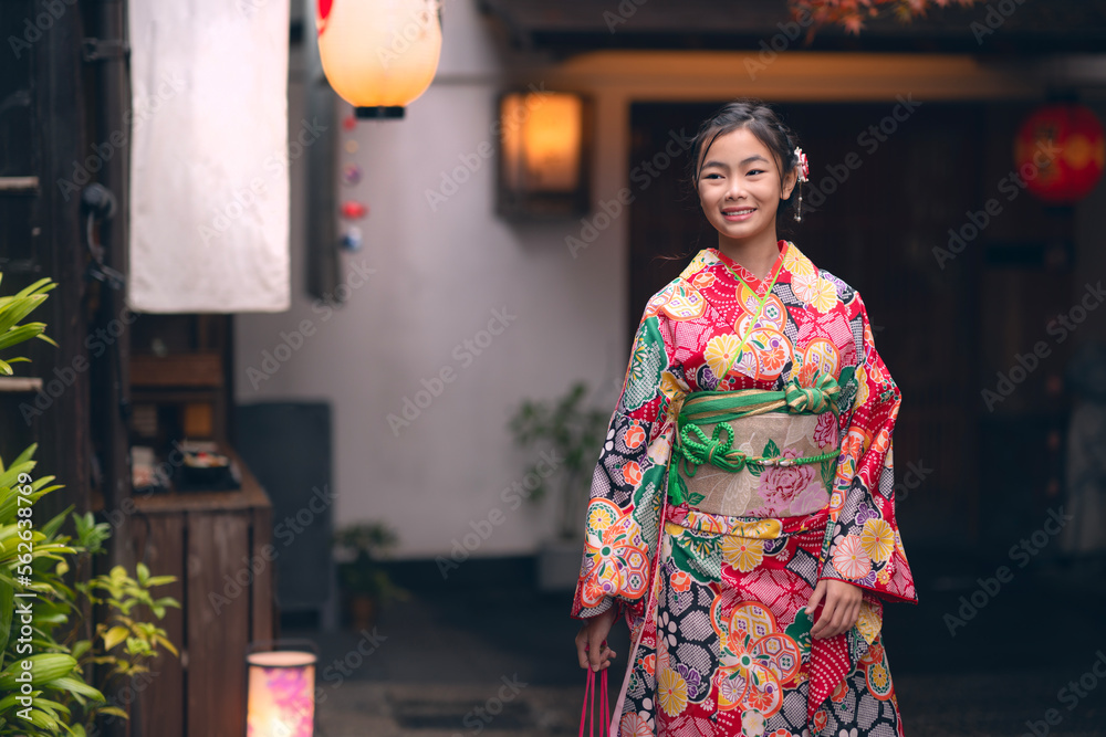 Asian traveler girl in Kimono traditional dress walking in old temple in Kyoto city