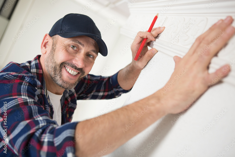 male plasterer puts venetian plaster on the wall male plasterer puts venetian plaster on the wall