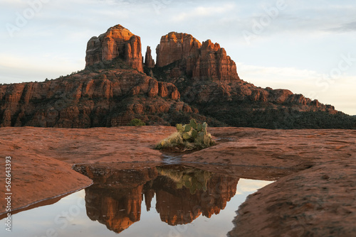Reflection photo taken at sunset in Sedona Arizona United States Yavapai County at sunset in winter of Cathedral Rock illuminated with reds and oranges photo