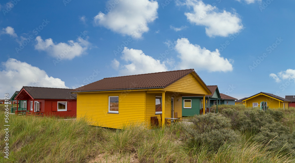 Beautiful and colorful wooden houses on the beach of the island Heligoland - Dune. Beautiful and colorful wooden houses on the beach of the island Heligoland - Dune.