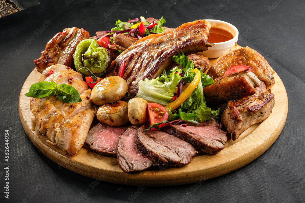grilled potatoes and meat with various sauces and greens grilled potatoes and meat with various sauces and greens