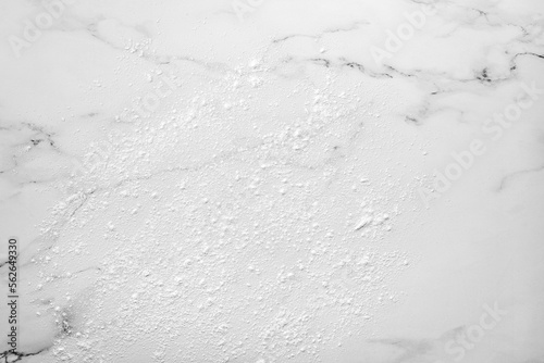 Marble background dusted with flour before rolling out cookie dough