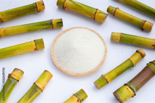 Sugar with sugar cane on white background.