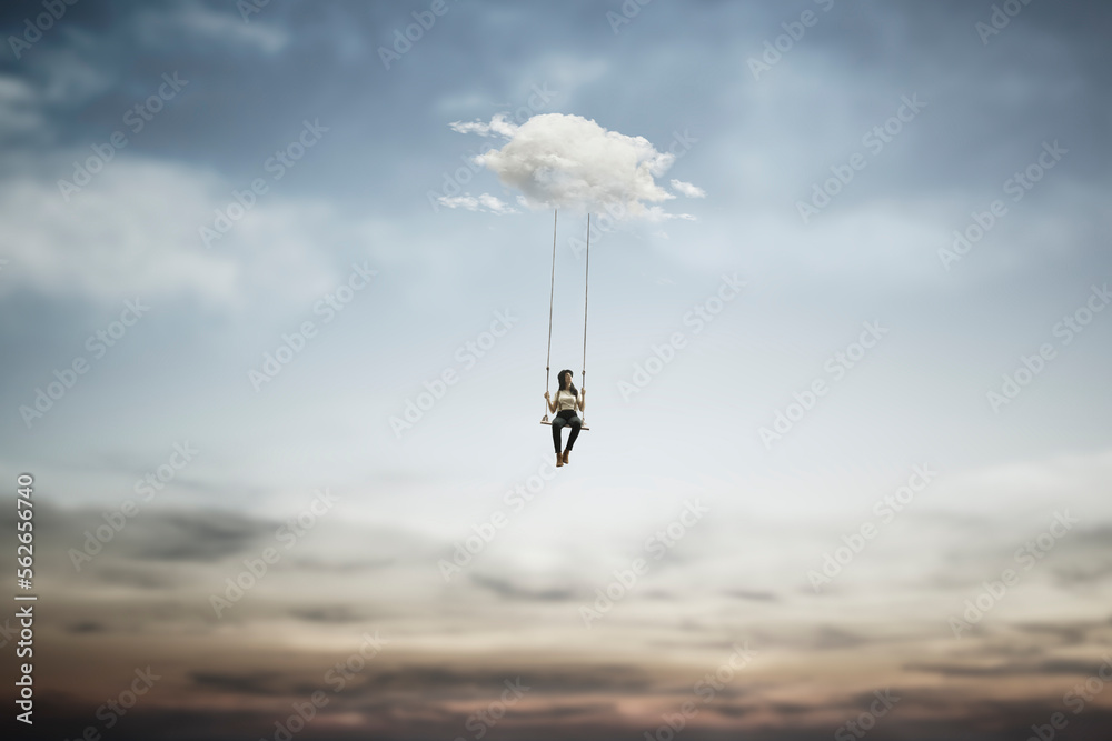 surreal woman having fun on a swing hanging from a cloud, abstract concept - obrazy, fototapety, plakaty 