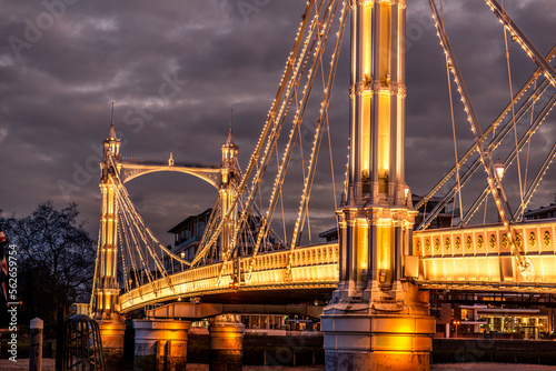 London Albert Bridge is a road bridge over the River Thames connecting Chelsea in Central London photo